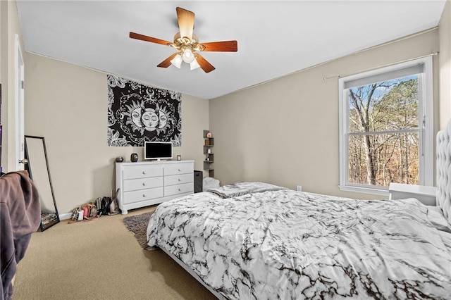 bedroom featuring ceiling fan and carpet flooring