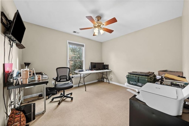 office with carpet floors and ceiling fan