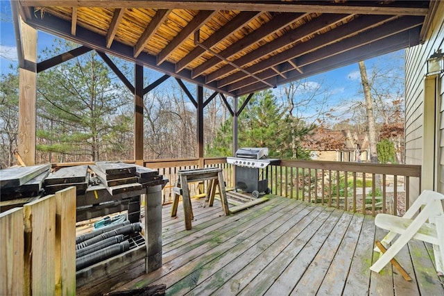 wooden deck featuring area for grilling