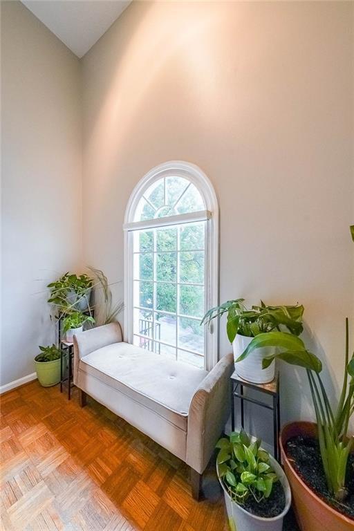 bedroom with a high ceiling and access to outside