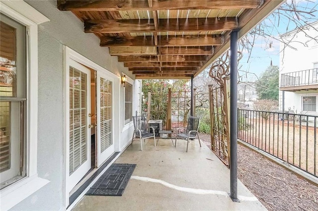 view of patio featuring fence