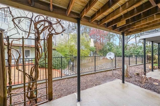 view of patio / terrace featuring fence