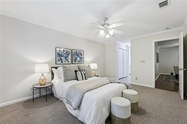 302 Ridley Howard Ct Unit 302, Decatur, GA 30030 - carpeted bedroom featuring a closet, ornamental molding, and ceiling fan