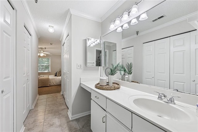 302 Ridley Howard Ct Unit 302, Decatur, GA 30030 - ensuite bathroom featuring a closet, vanity, a textured ceiling, ceiling fan, and tile patterned floors