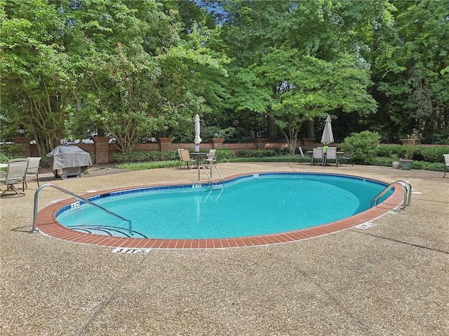 302 Ridley Howard Ct Unit 302, Decatur, GA 30030 - community pool featuring a patio