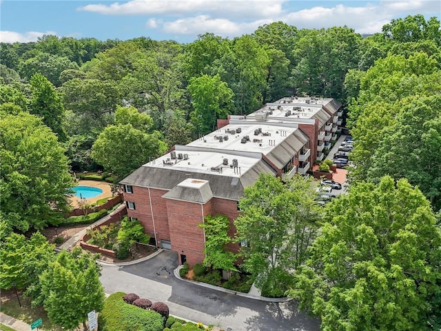 302 Ridley Howard Ct Unit 302, Decatur, GA 30030 - drone / aerial view of a pool and a heavily wooded area