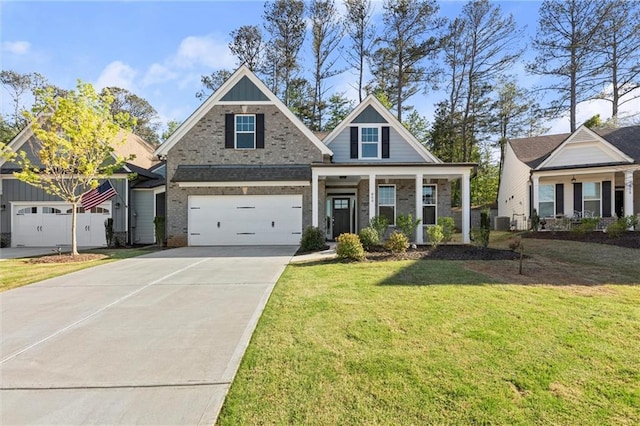 craftsman house featuring central AC, driveway, brick siding, a front yard, and a garage