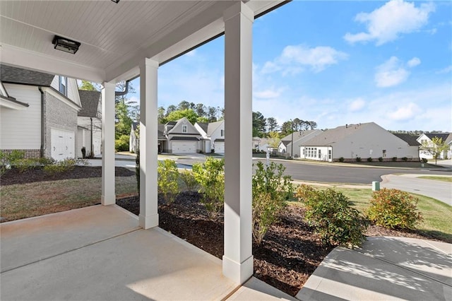 view of patio / terrace with covered porch and a residential view