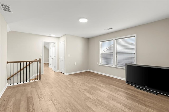 spare room with visible vents and light wood-style floors