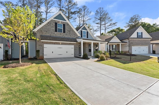 craftsman-style house featuring brick siding, an attached garage, a front lawn, and concrete driveway