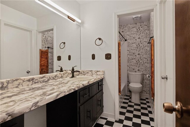 6945 Butner Rd, Atlanta, GA 30349 - full bath with tile patterned floors, vanity, shower / bathtub combination with curtain, and toilet