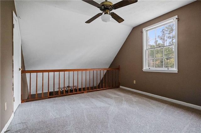 6945 Butner Rd, Atlanta, GA 30349 - additional living space featuring ceiling fan, lofted ceiling, baseboards, and carpet