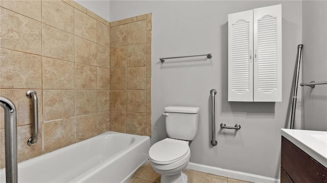 bathroom with shower / washtub combination, toilet, vanity, baseboards, and tile patterned floors