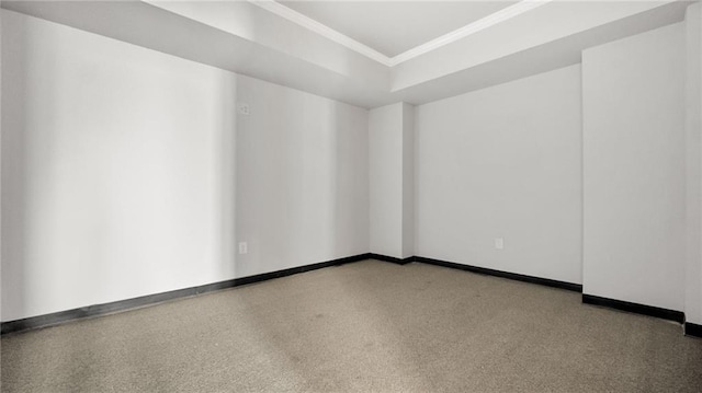 unfurnished room featuring crown molding and baseboards