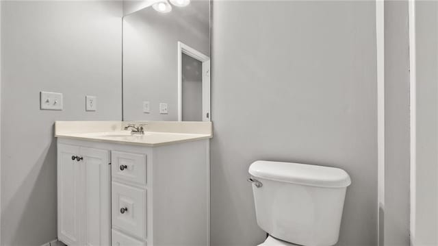 bathroom with toilet and vanity