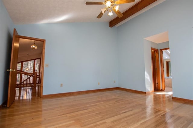 unfurnished room featuring light wood-type flooring, vaulted ceiling with beams, and ceiling fan with notable chandelier