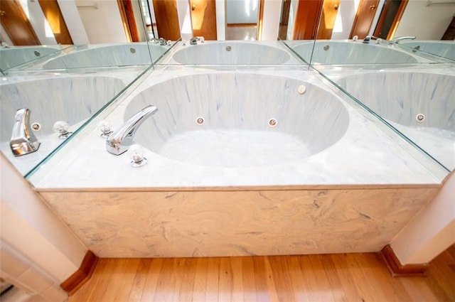 bathroom featuring hardwood / wood-style floors and a bathtub