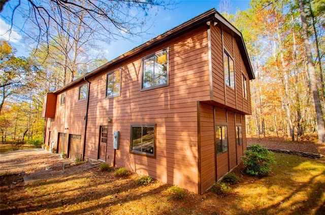 view of side of home with a garage