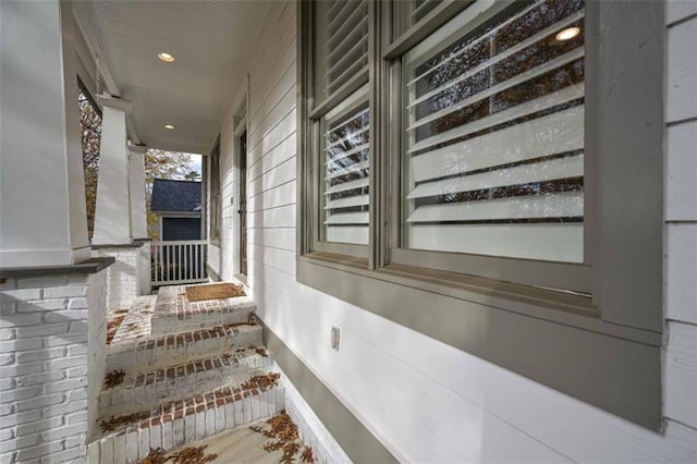 view of property exterior with covered porch