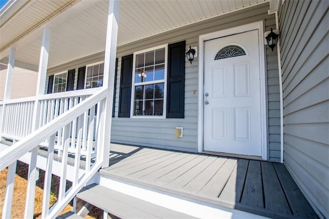 property entrance featuring a porch