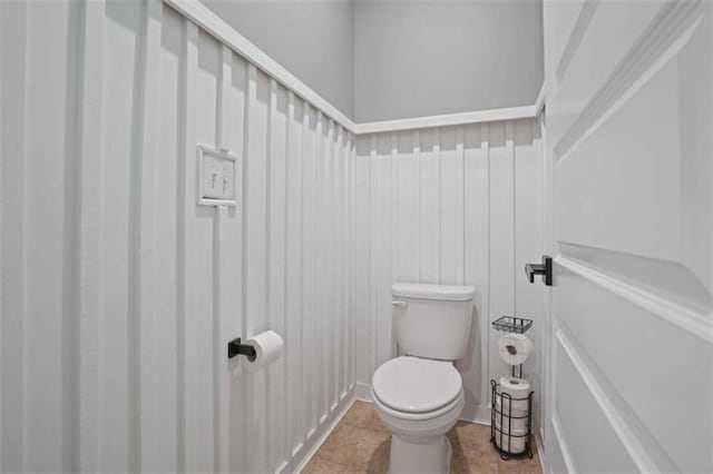 bathroom featuring tile patterned flooring and toilet