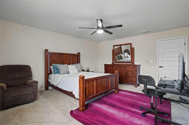 carpeted bedroom with ceiling fan and visible vents