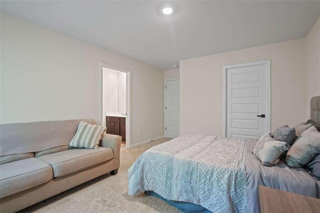 bedroom featuring recessed lighting, light carpet, and baseboards