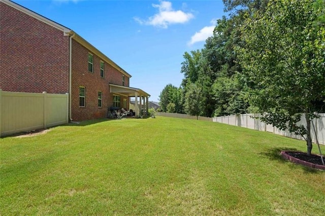 view of yard featuring a fenced backyard