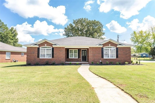 single story home featuring a front lawn