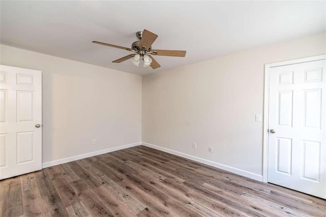 unfurnished room with hardwood / wood-style flooring and ceiling fan