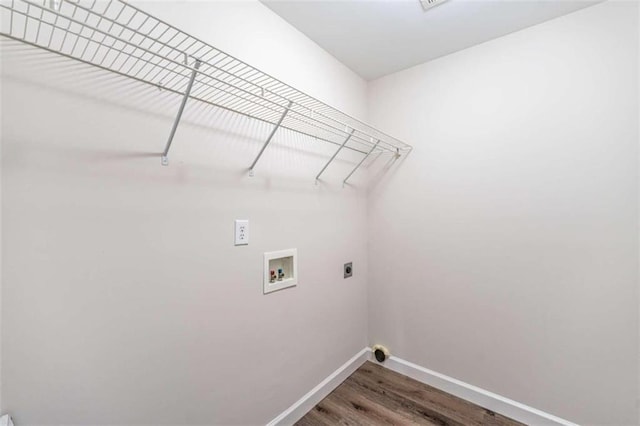 clothes washing area featuring washer hookup, hookup for an electric dryer, and wood-type flooring