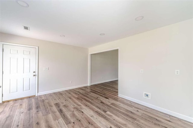 unfurnished room featuring light hardwood / wood-style flooring