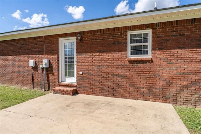 property entrance with a patio area