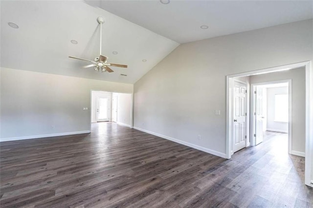 empty room with high vaulted ceiling, ceiling fan, and dark hardwood / wood-style flooring