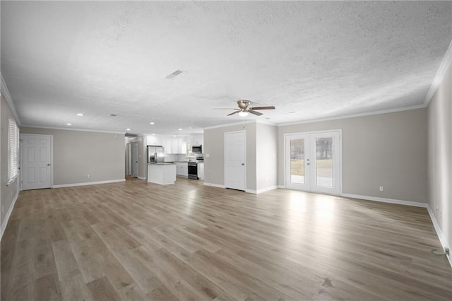 unfurnished living room featuring visible vents, crown molding, light wood-style floors, a textured ceiling, and a ceiling fan