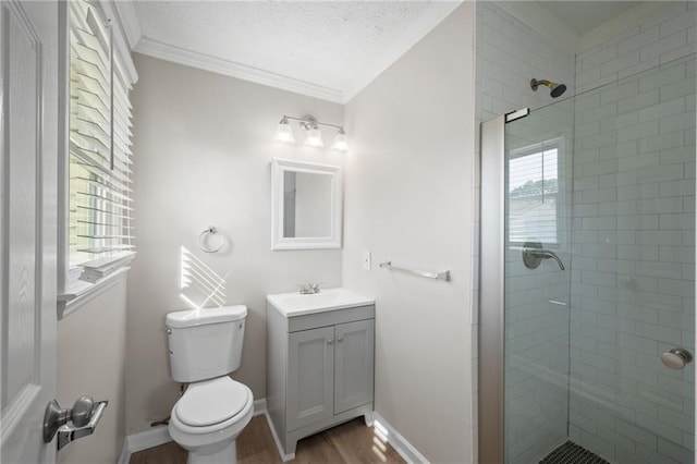 full bath featuring a shower stall, toilet, crown molding, and wood finished floors