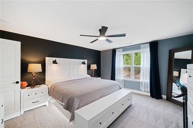 bedroom featuring ceiling fan and light colored carpet