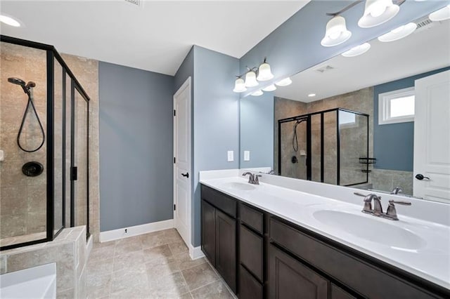 bathroom with walk in shower and vanity