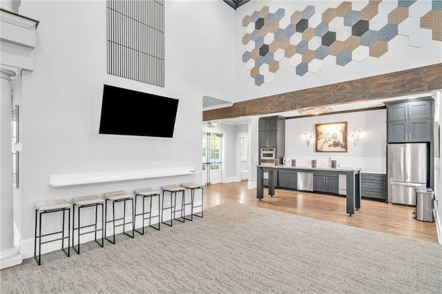 living room with a towering ceiling