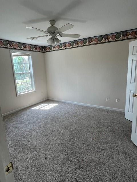 unfurnished room featuring baseboards, ceiling fan, and carpet floors
