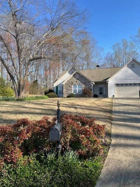 view of front of property with an attached garage and concrete driveway