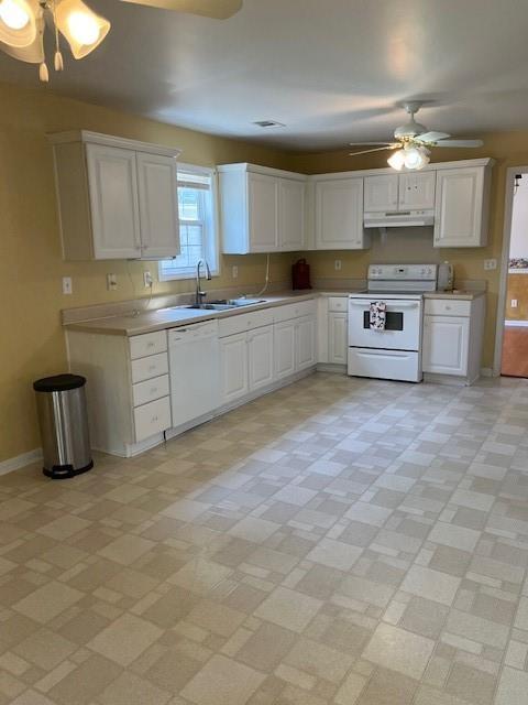 kitchen with light countertops, under cabinet range hood, white appliances, white cabinets, and ceiling fan