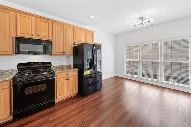 kitchen featuring black appliances, dark wood-style floors, light stone countertops, tasteful backsplash, and recessed lighting