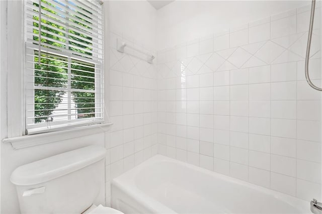 bathroom with toilet and  shower combination