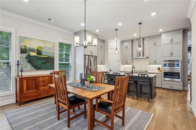 408 Townly Ct, Alpharetta, GA 30009 - dining room featuring crown molding, recessed lighting, and light wood-style floors
