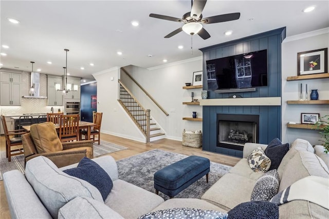 408 Townly Ct, Alpharetta, GA 30009 - living room with crown molding, recessed lighting, light wood-style flooring, stairway, and ceiling fan