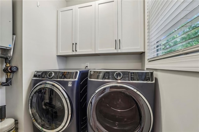408 Townly Ct, Alpharetta, GA 30009 - laundry area with washer and dryer and cabinet space