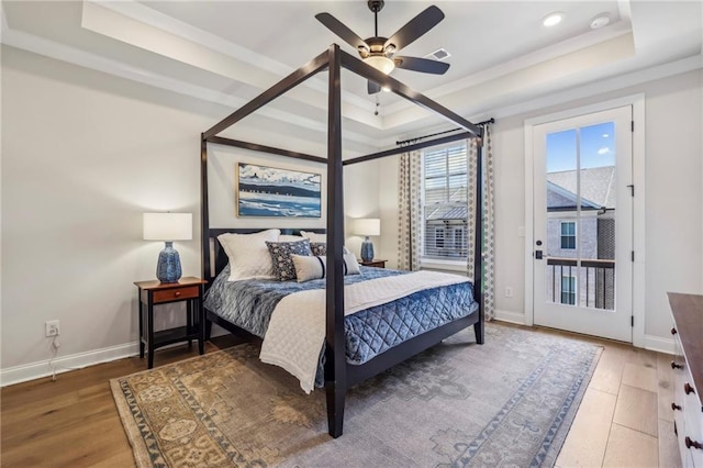 408 Townly Ct, Alpharetta, GA 30009 - bedroom featuring a raised ceiling, wood finished floors, access to outside, baseboards, and recessed lighting
