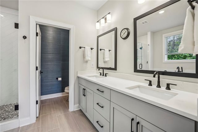 408 Townly Ct, Alpharetta, GA 30009 - full bathroom with double vanity, a stall shower, baseboards, and toilet
