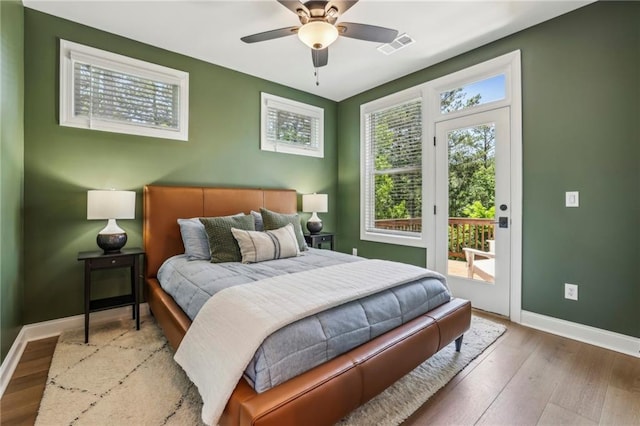 408 Townly Ct, Alpharetta, GA 30009 - bedroom featuring access to outside, baseboards, wood finished floors, and a ceiling fan